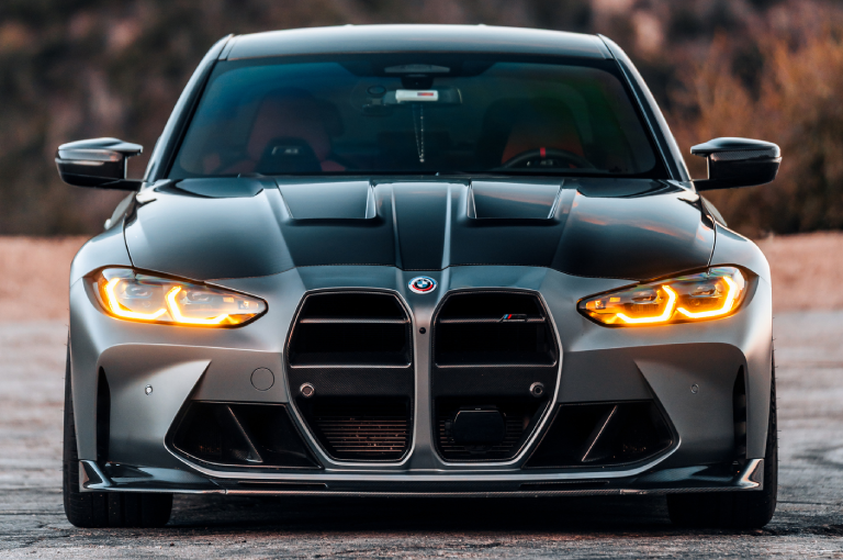 2025 BMW M3 parked on the side of a road.