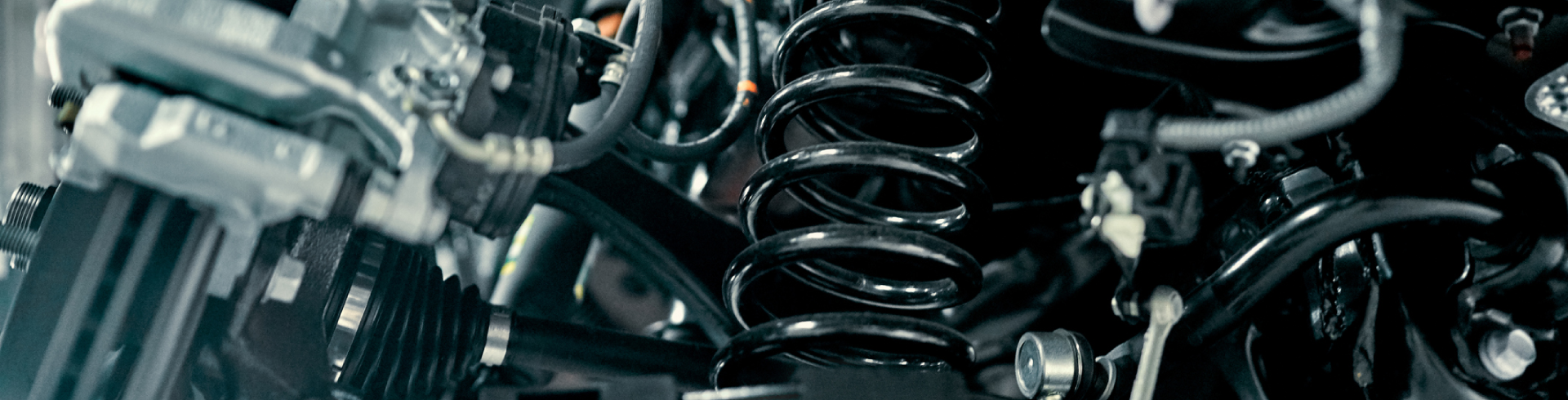 Close up of rear suspension repair of an Audi vehicle.