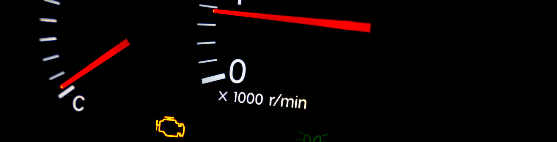 Audi check engine light on, illuminated orange on vehicle dashboard.