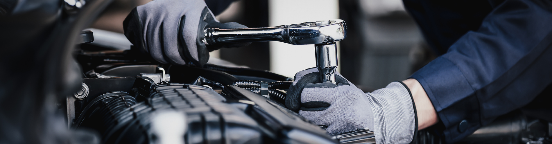 Professional mechanic working on the engine of the car in Woodinville, WA.